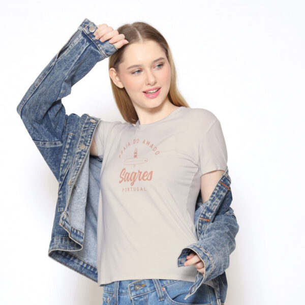 Soft women’s T-shirt in pearl color inspired by Amado Beach, Sagres, Portugal. Flattering fit, breathable fabric, and stylish coastal design perfect for summer beach days or casual wear.